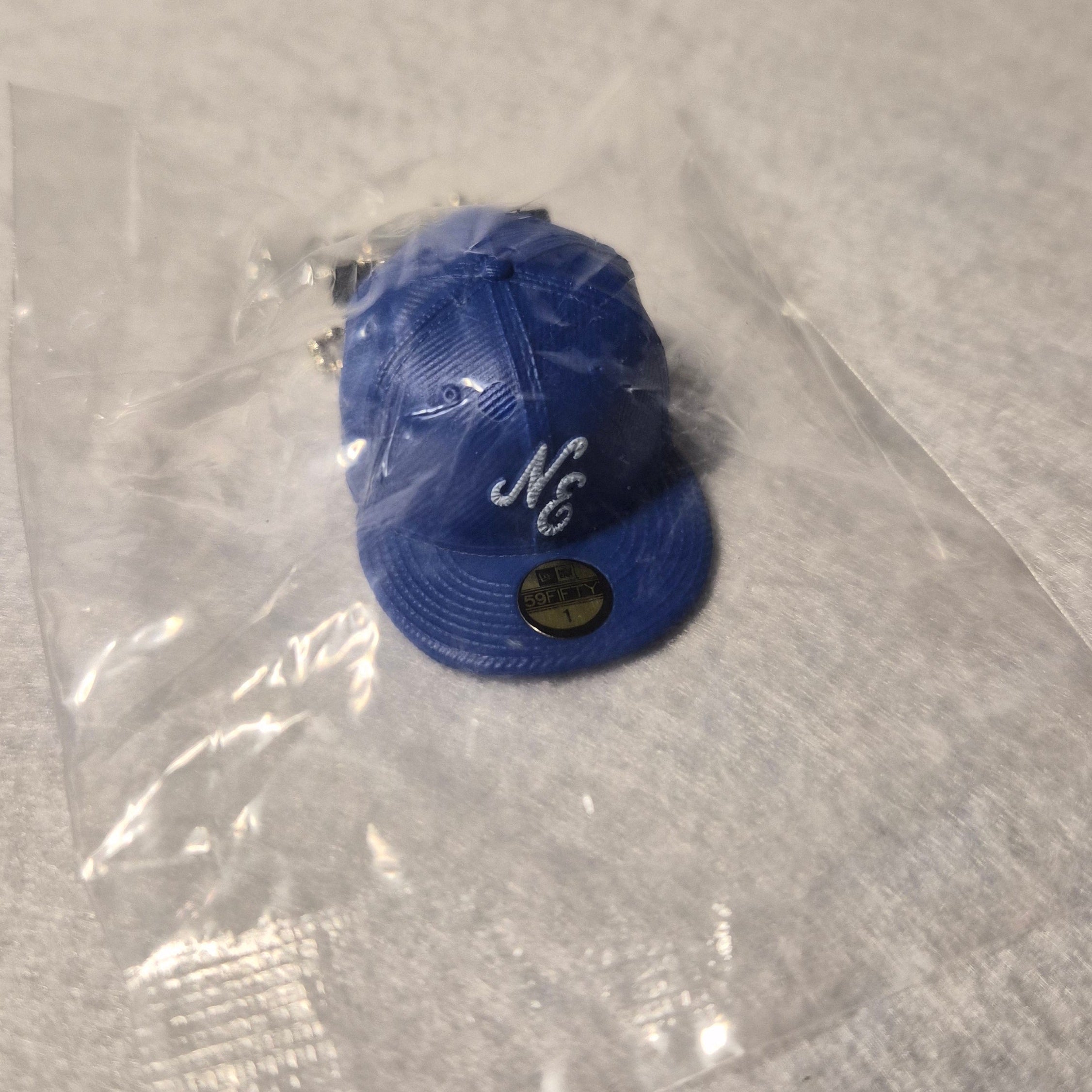 🧢 Colección Miniaturas Gorra New Era - Colgante