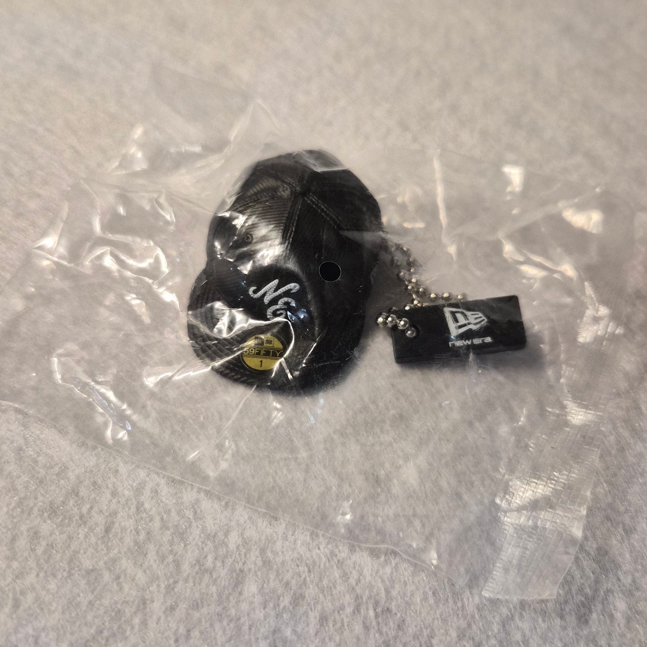 🧢 Colección Miniaturas Gorra New Era - Colgante