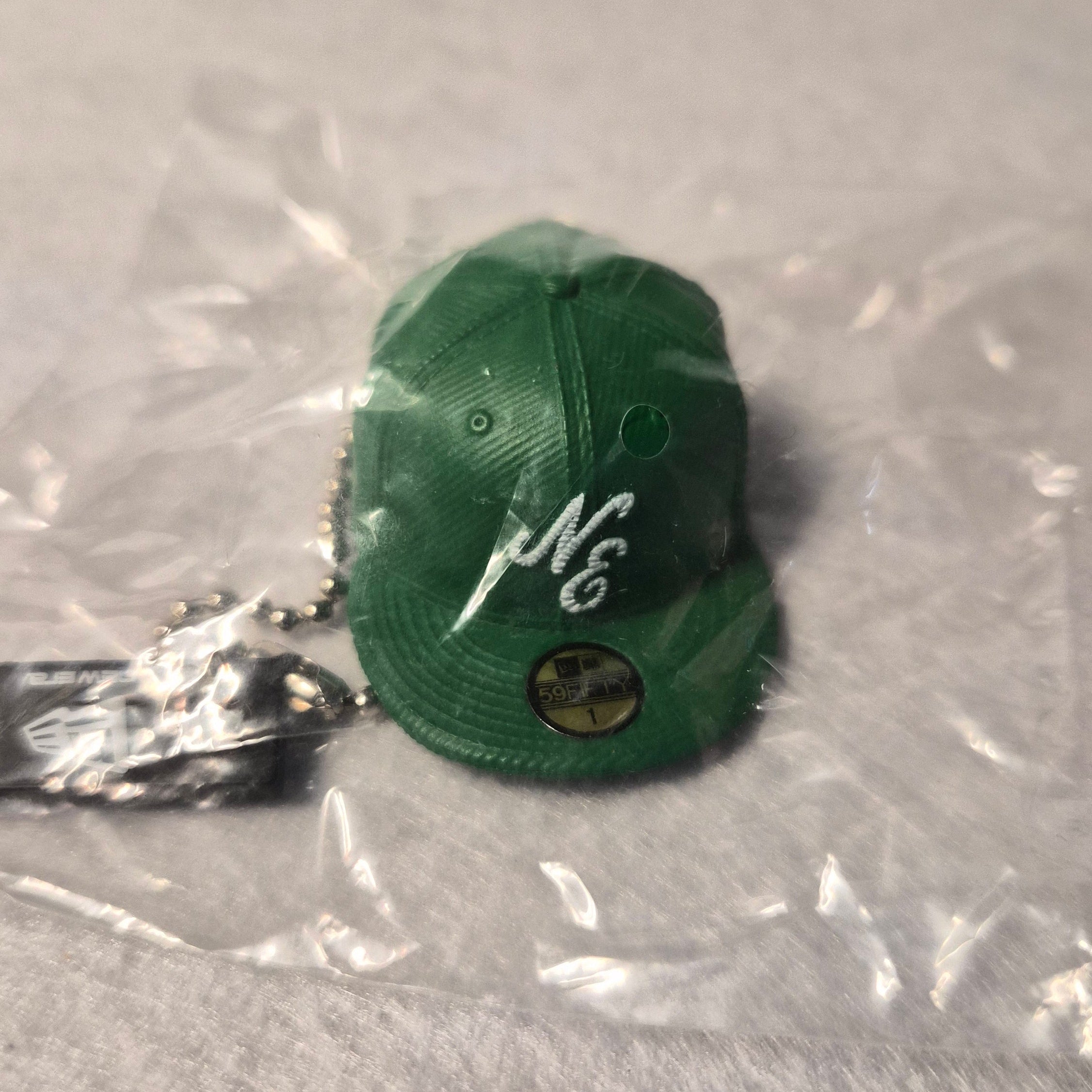 🧢 Colección Miniaturas Gorra New Era - Colgante