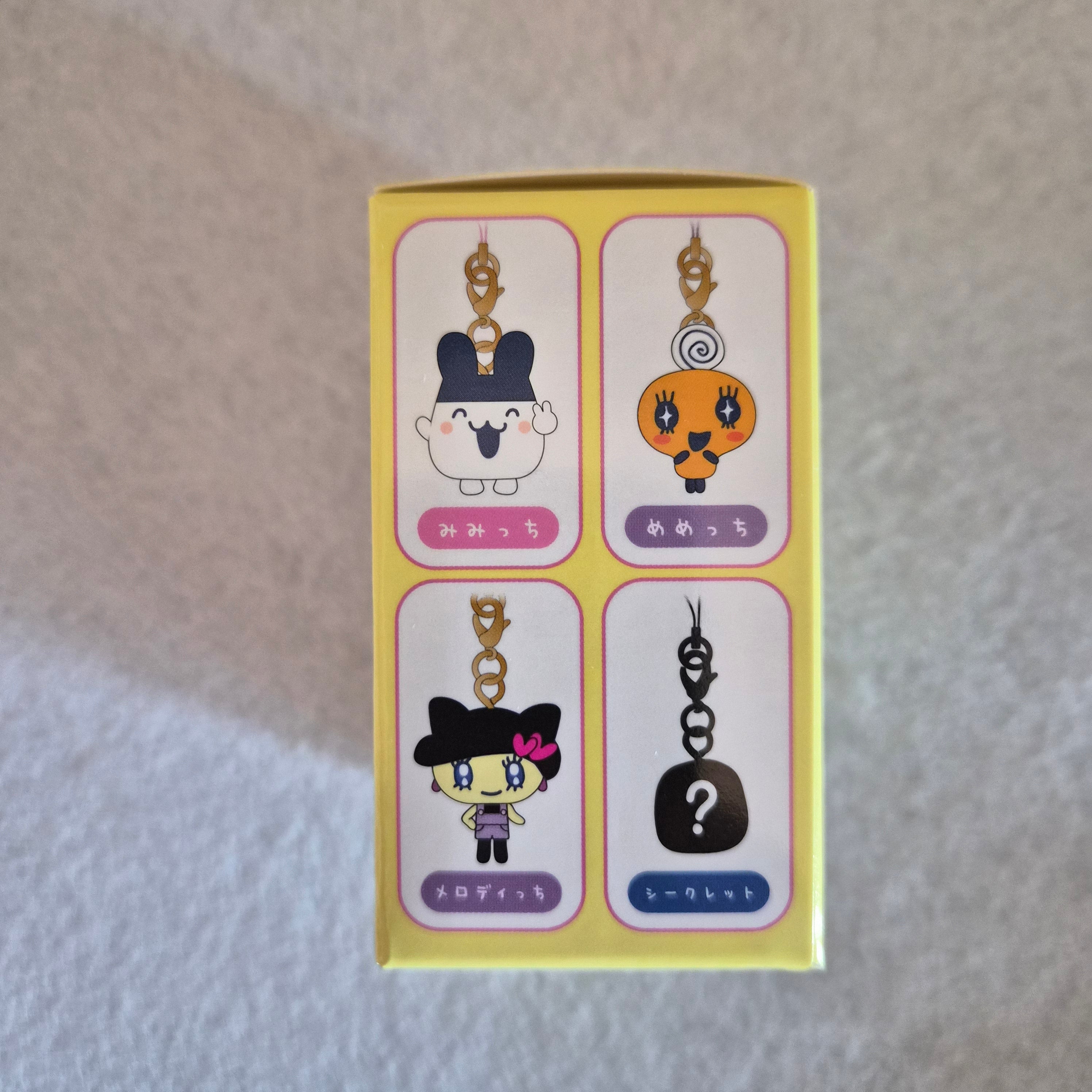🎀 Colgante Coleccionable Bandai: Tamagotchi - Trading Mascot Strap